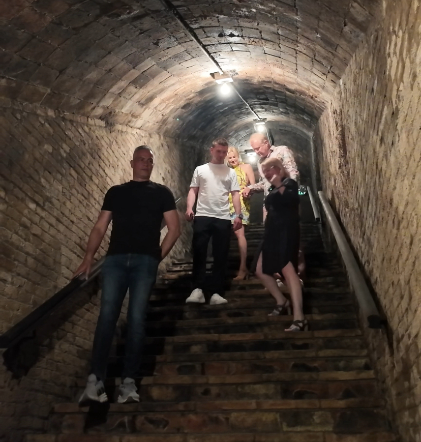 Walking down into a historic cava cellar