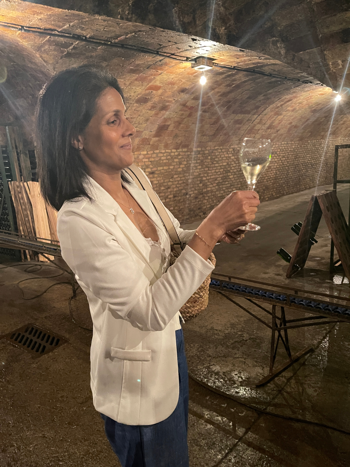 Tasting cava in a vaulted underground cellar