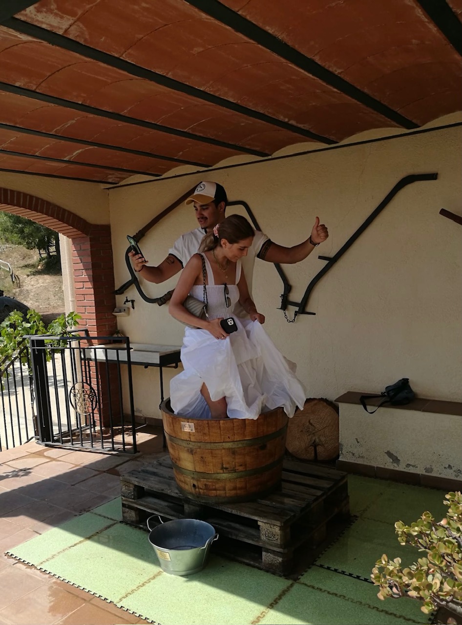 Traditional grape stomping in a wooden barrel at the winery